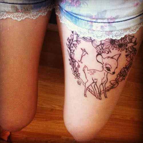 Tattoo Bambi im Blumenherz Oberschenkel Tattoo