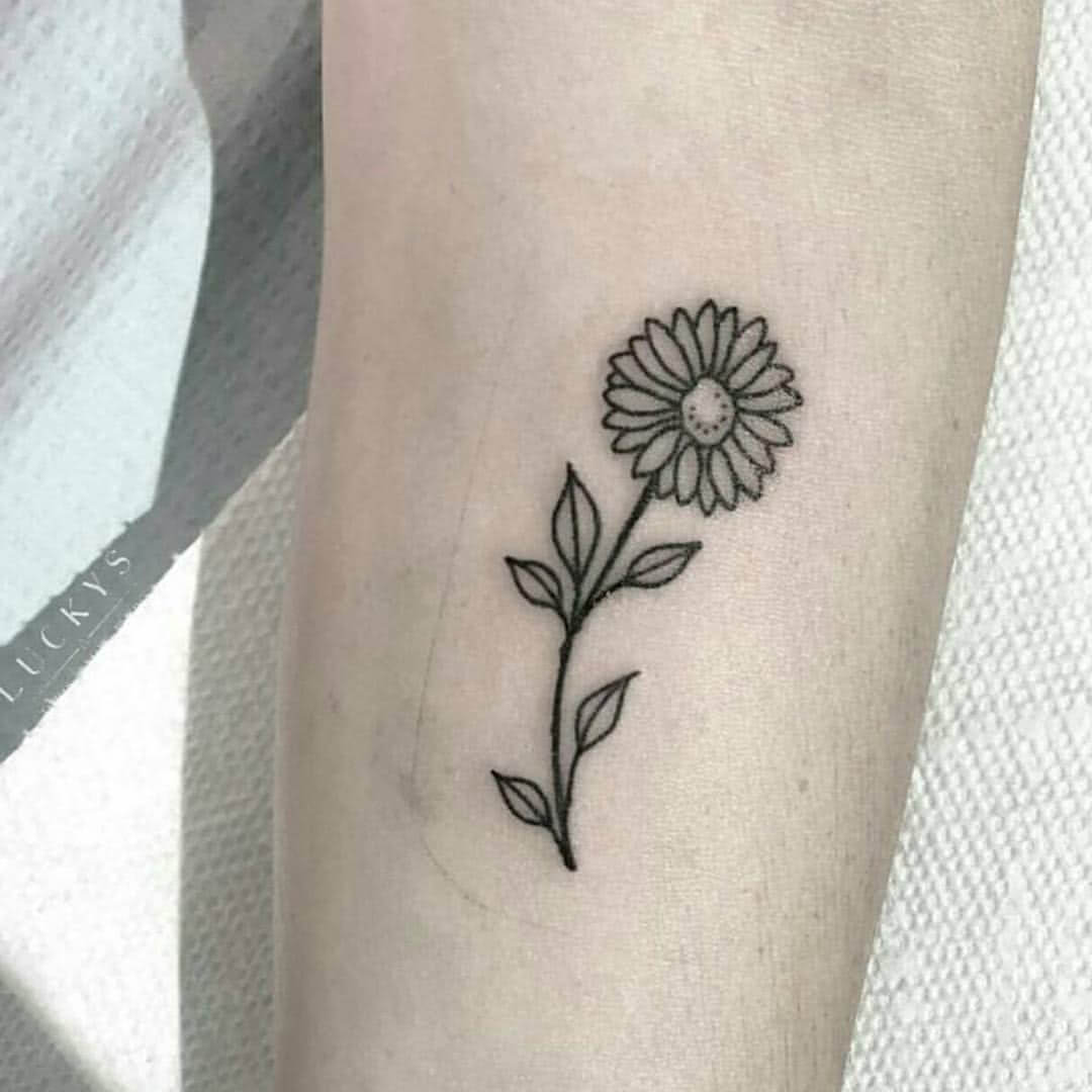 Tattoo schwarzes Gänseblümchen